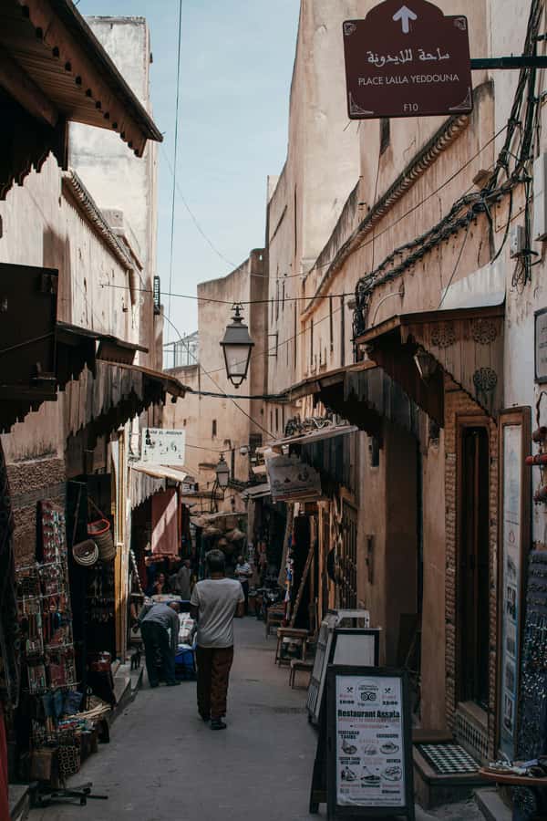 A tour with an expert guide in the old city of Fez - Nejjarine Fountain mosaics and mosque minarets at human scale