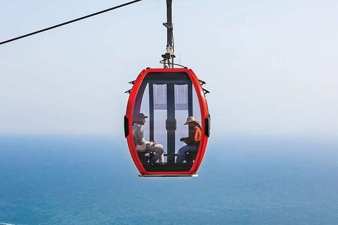 Cable Car Experience and Agadir City Tour. - Mohamed V Mosque exterior: doors, stone details, and easy photo time