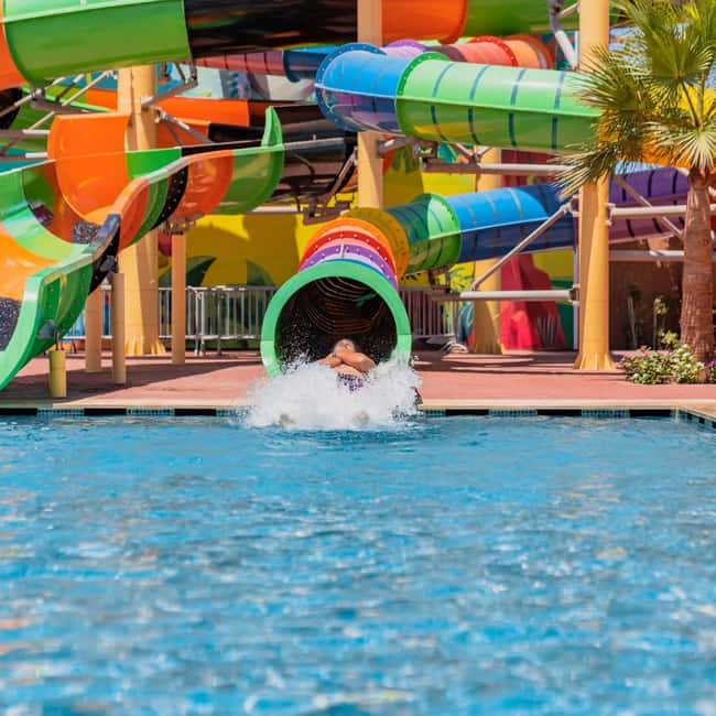 From Agadir: Aqua Park Entry with Transfers - Slides, wave pool, splash zones, and shaded breaks