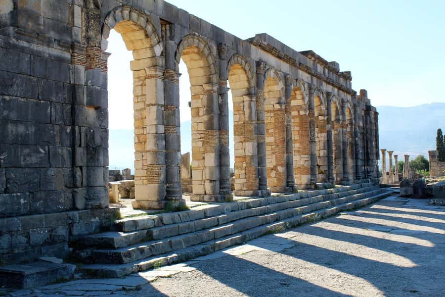 From Fez: Volubilis Moulay Idriss and Meknes Day Trip - Volubilis Roman ruins: Arch of Caracalla to the Basilica area
