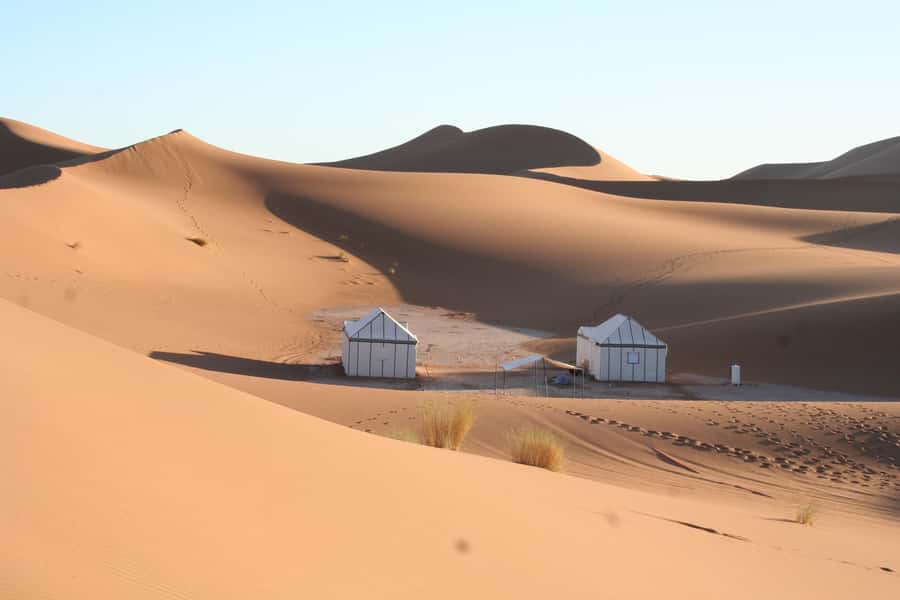 From Marrakech 3 Days Sahara Luxey Camp - Day 1: Ait Benhaddou, Roses Valley, Skoura palms, and Dades area lodging