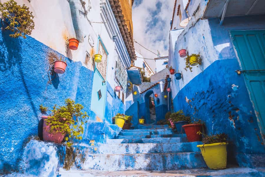 From Marrakech: 4-Day Journey Imperial Cities & Chefchaouen - Day 2 in Fez: Guided medina highlights, Medersas, Qarawiyyin access, and souks