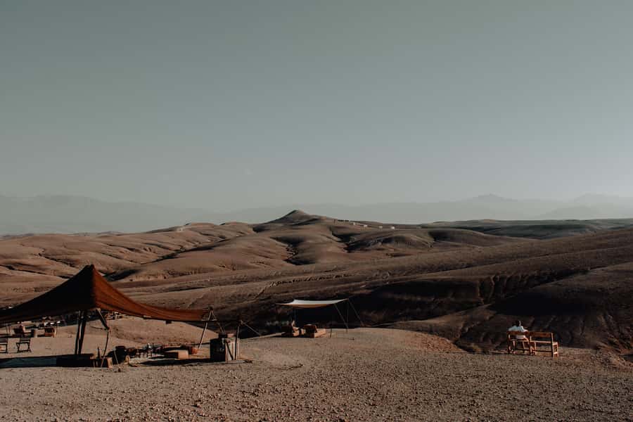 From Marrakech: Agafay Desert Sunset, Camel Ride, and Dinner - Berber music, dance, and the fire twirler moment