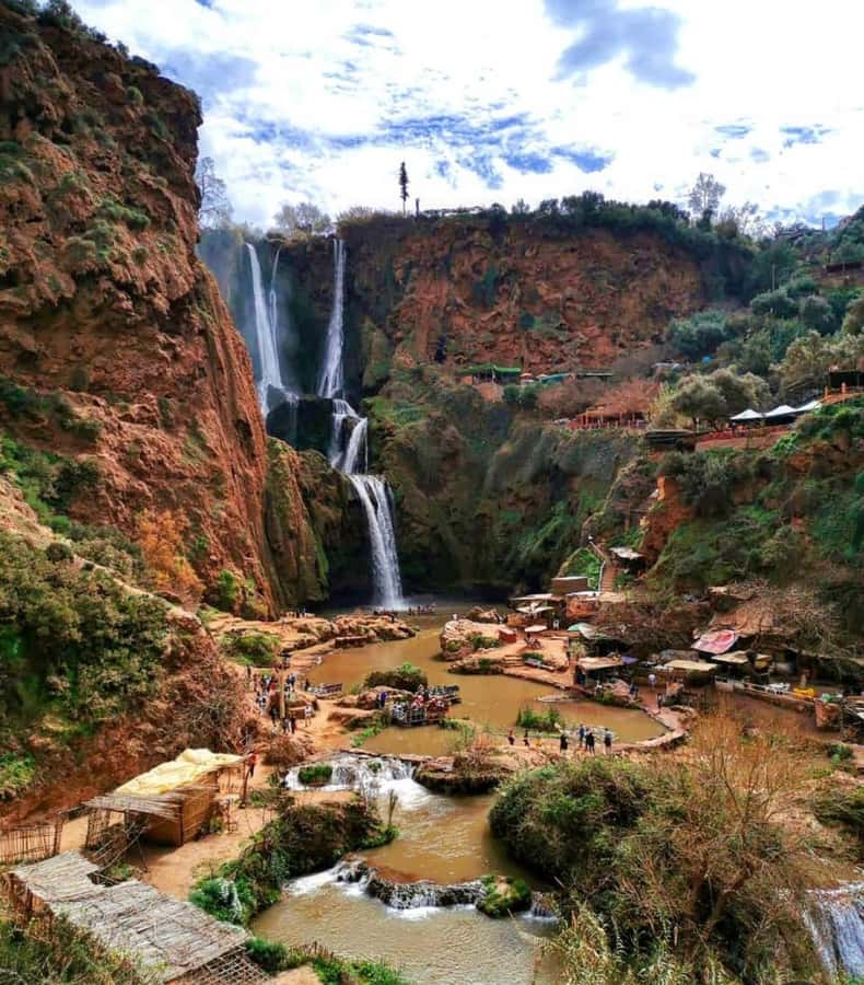 From Marrakech:Ouzoud Waterfalls Day Trip with Boat Tour - Arriving at Ouzoud: red cliffs, olive groves, and the first big views