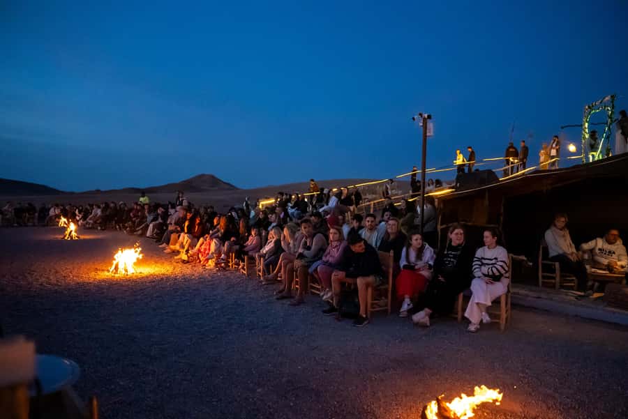 From Marrakech: Sunset Desert Tour with Camel Ride & Dinner - Bonfire, Berber music, and the fire show: fun with a real crowd energy
