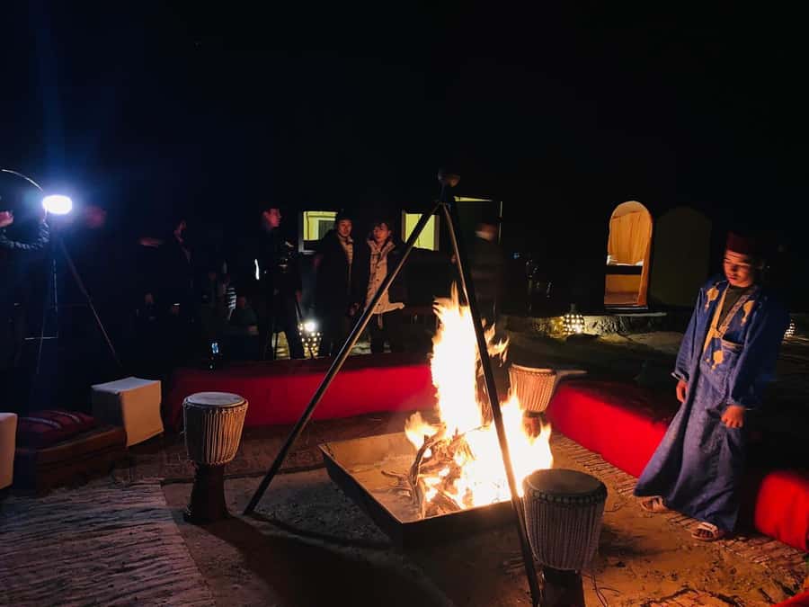From Zagora: Overnight Desert Tour to Erg Chigaga Camel ride - The desert camp night: dinner, Berber music, stargazing