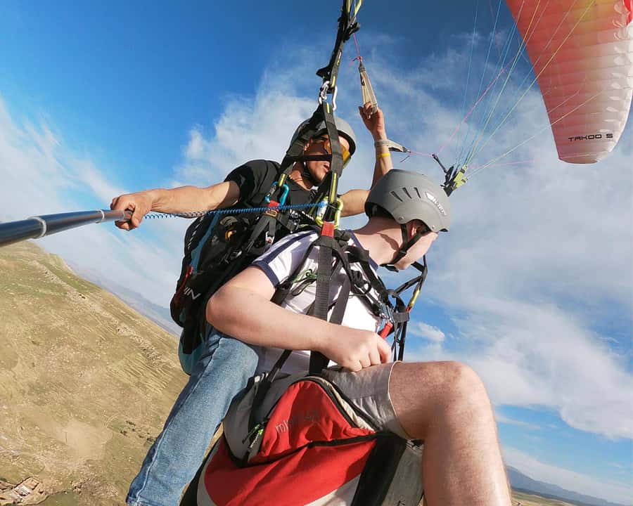 Marrakech: Atlas Mountains Paragliding Tour with Video - Getting Picked Up in Marrakech and Riding Out to Akerkor
