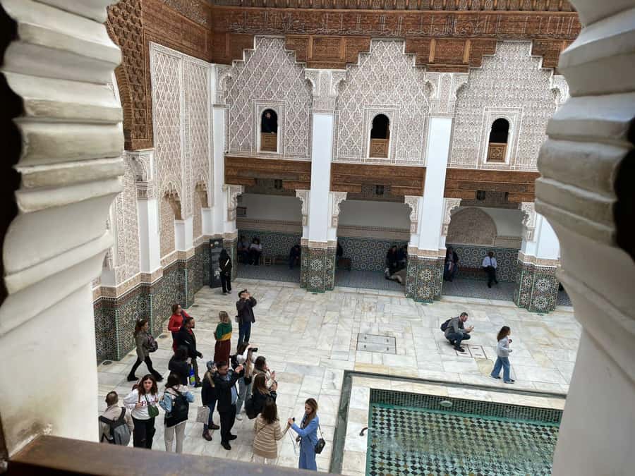 Marrakech: Ben Youssef Guided Tour with Skip-the-Line Entry - Photo stops, Koubba Almoravid, and artisan workshop context