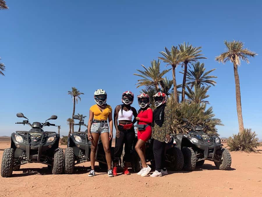 Marrakech: Desert and Palm Grove Sunset Quad Tour with Tea - Riding through palm groves, desert hills, and rocky terrain