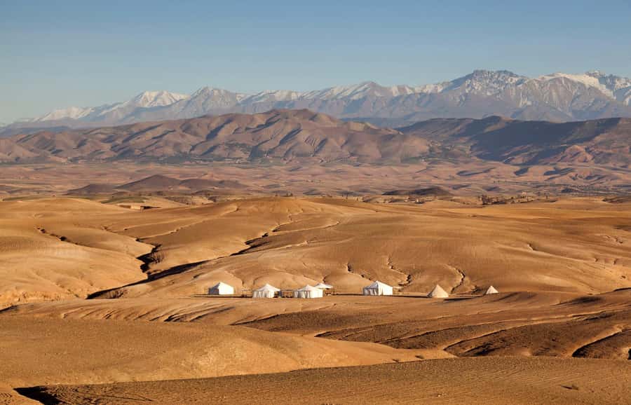 Marrakesh: Desert & Mountain Tour with Camel Ride & Lunch - Agafay Desert camp, camel ride and tea on rocky terrain