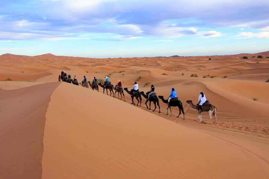 Merzouga: 1-Night in Desert Camp With Dinner & camel ride - Sunset camel ride over Erg Chebbi, plus sandboarding fun