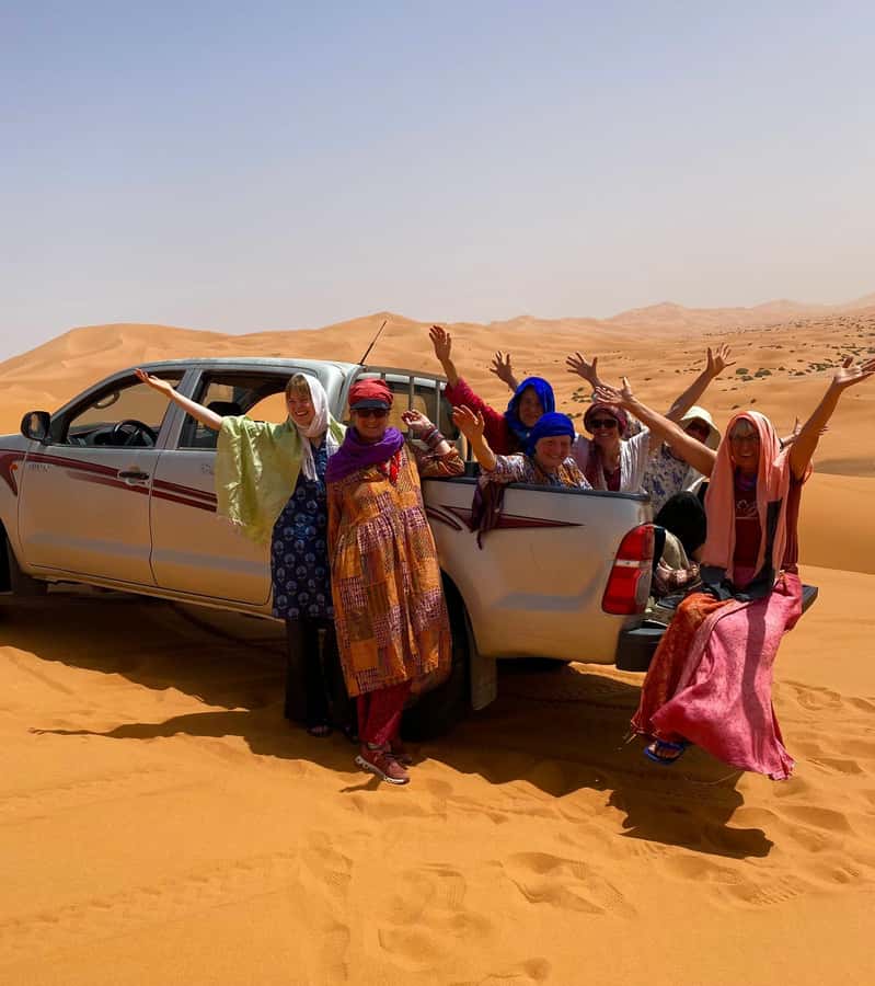 Merzouga: Overnight Stay in Luxury Desert Tent with Dinner - Camp life at night: luxury tent, private shower, and real warmth