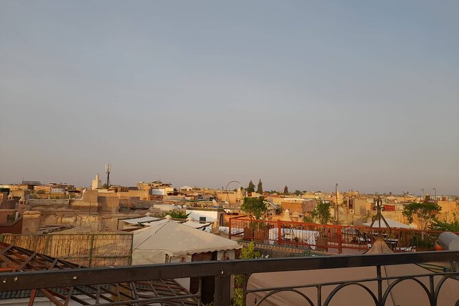 Private Full Day Tour to Marrakech from Casablanca - Menara Gardens and Pavilion: shade, olive trees, and a Koutoubia sightline